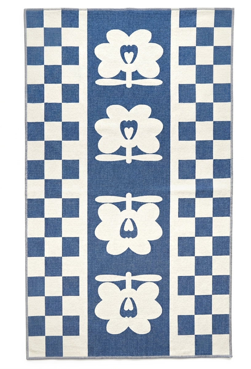 Blanket with blue and white checkered pattern and floral designs