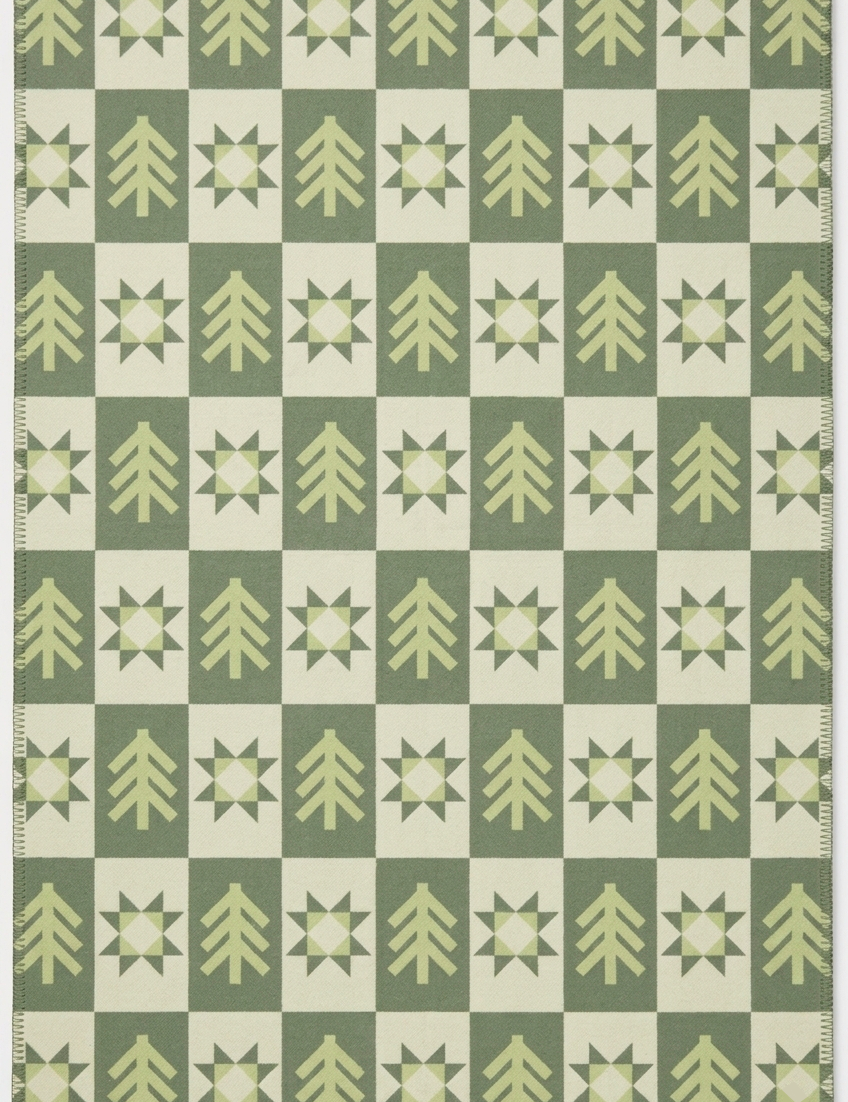 Green blanket with forest pattern in color green and beige