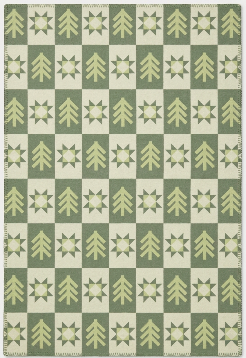 Green blanket with forest pattern in color green and beige