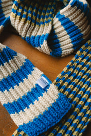 zoomed in picture of details of a merino scarf_blue beige and greenish yellow_nepal_winter