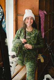 girl sitting wearing the Les Saisons and Turbo Bambi base layer