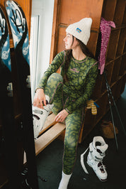 girl wearing Les Saisons and Turbo Bambi underlayer base in a ski shack