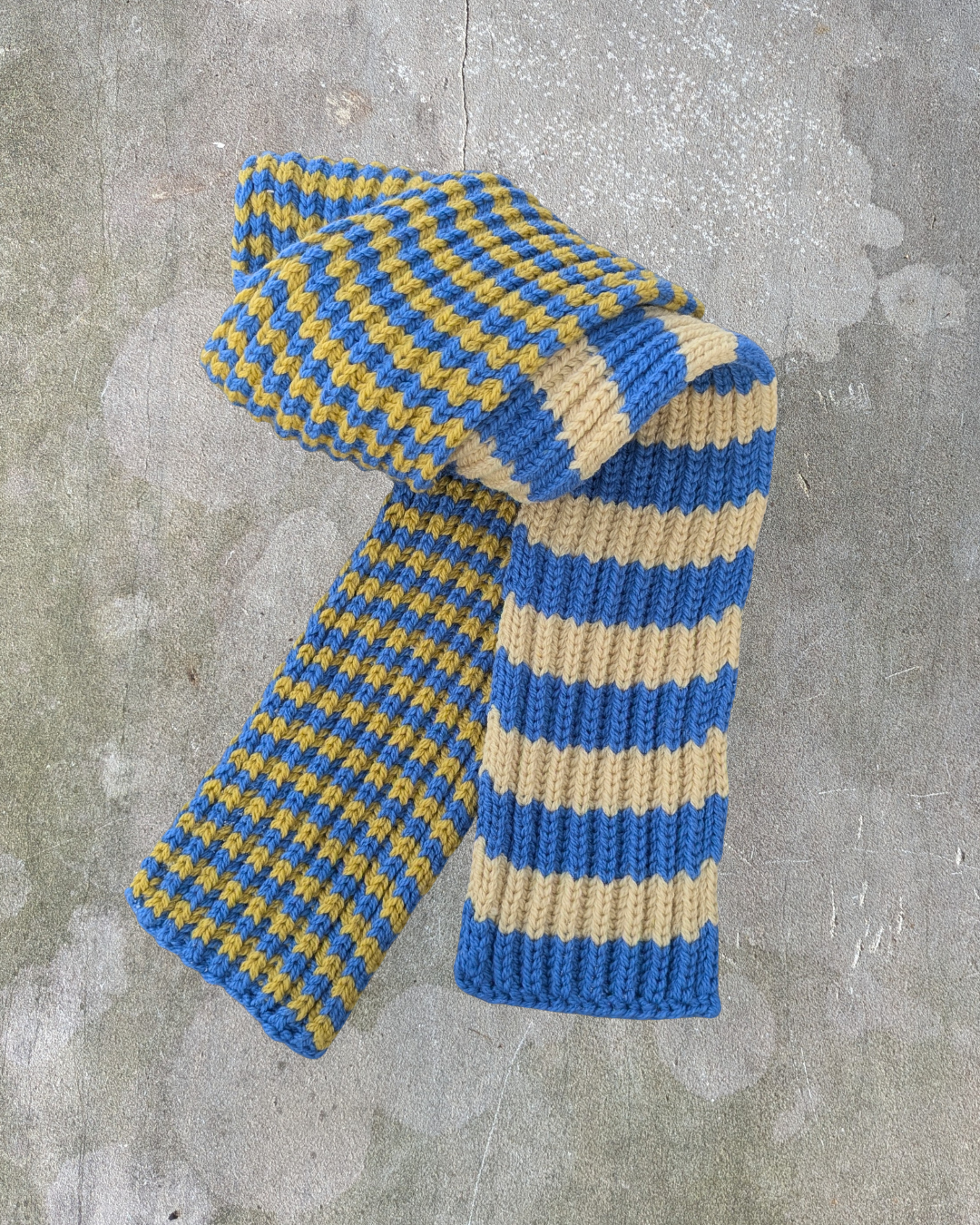 Knitted scarf with blue and beige stripes merino