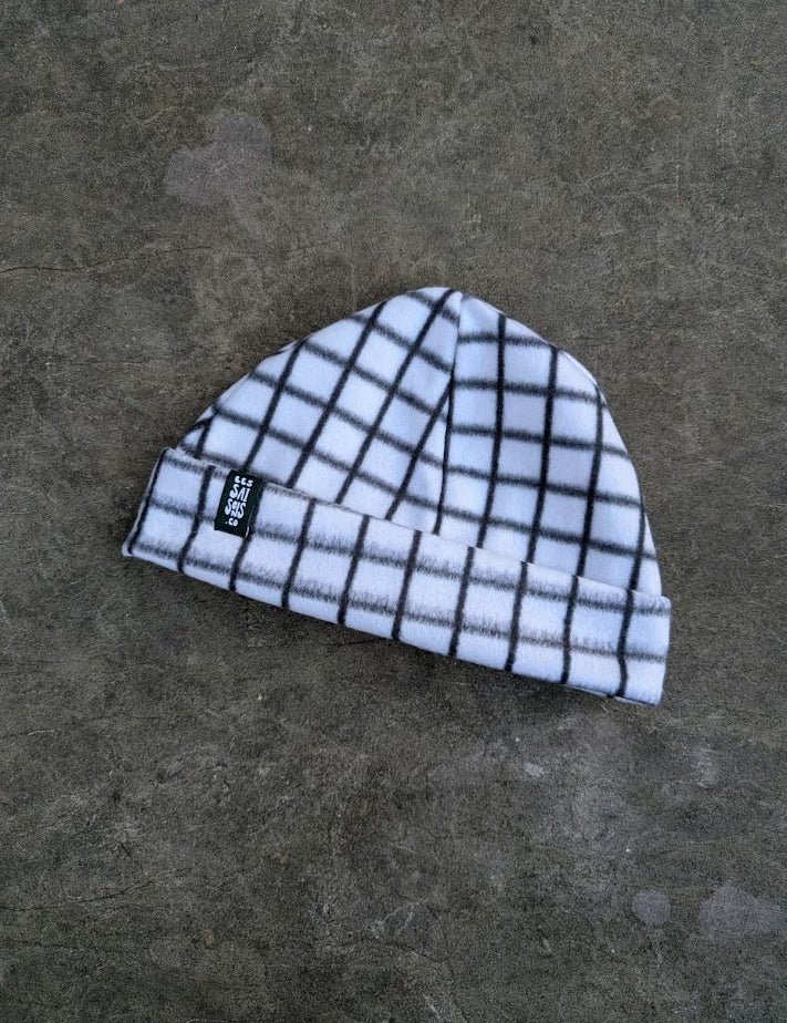 Lightly checkered black and white fleece beanie