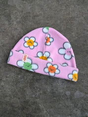 Light pink fleece beanie with daisy pattern