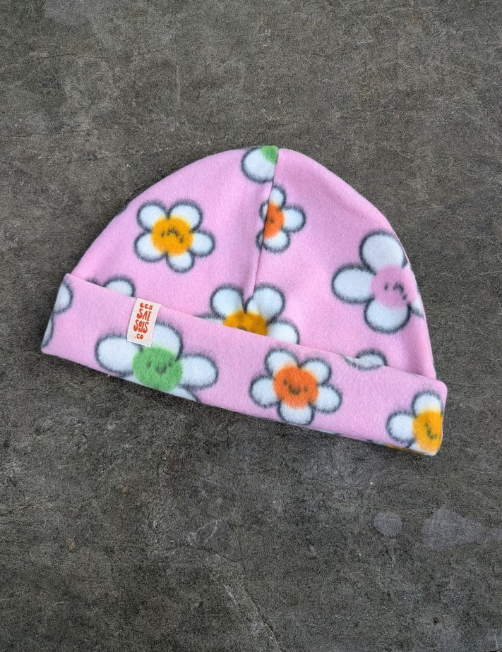Light pink fleece beanie with daisy pattern