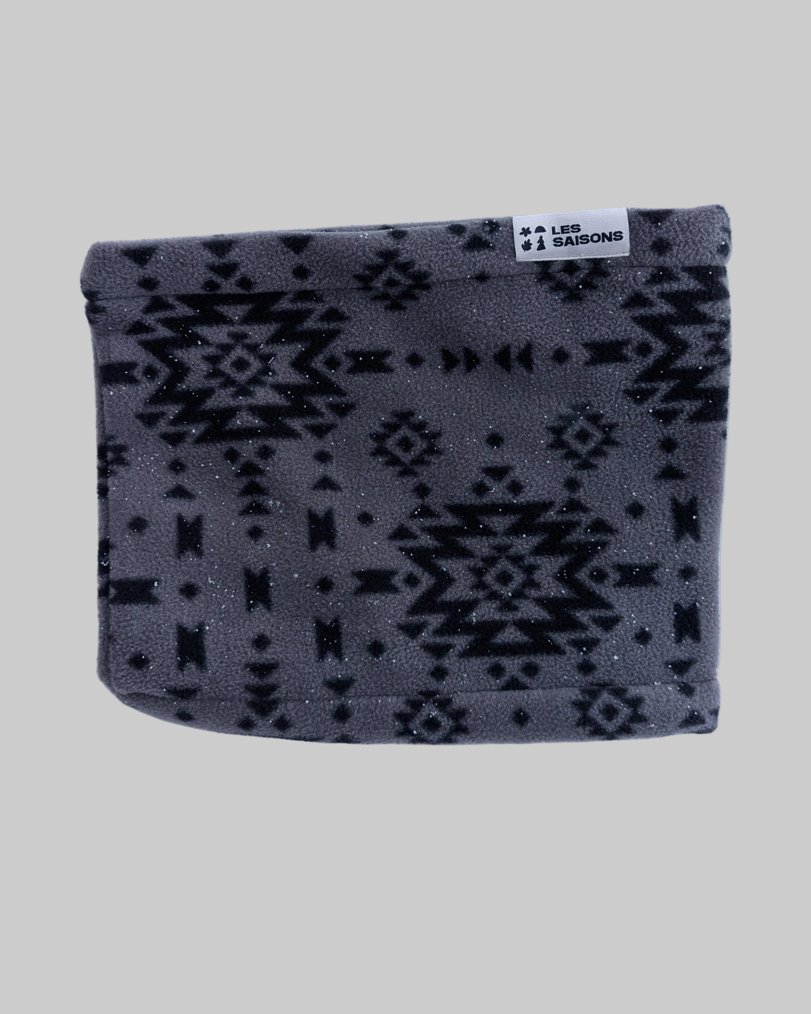 Gray patterned pouch with a brand label on a white background